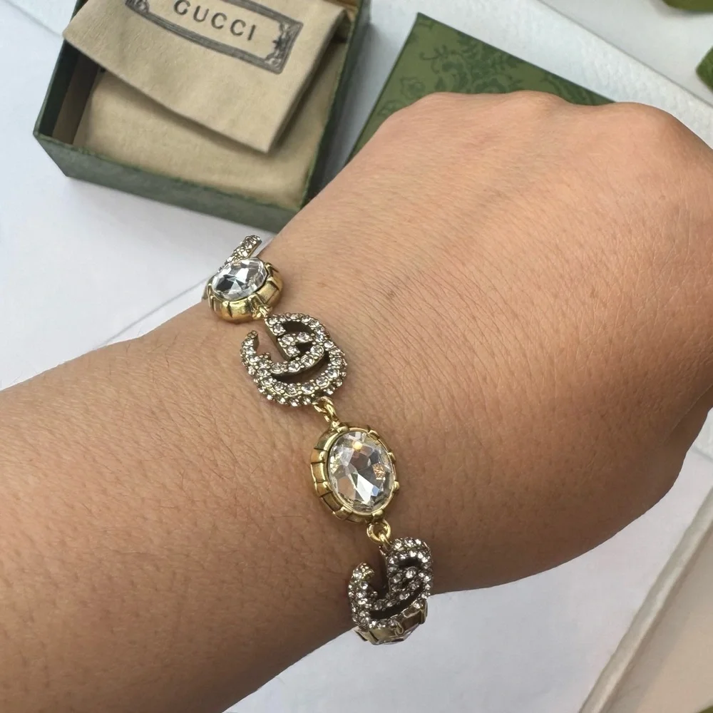Gucci Crystal-Embellished Gold and Silver Bracelet - Picture 1 of 12